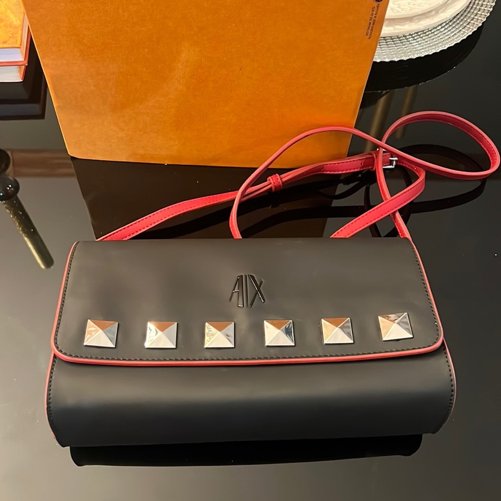 Armani Exchange bag with red straps. Can be used as a large clutch.